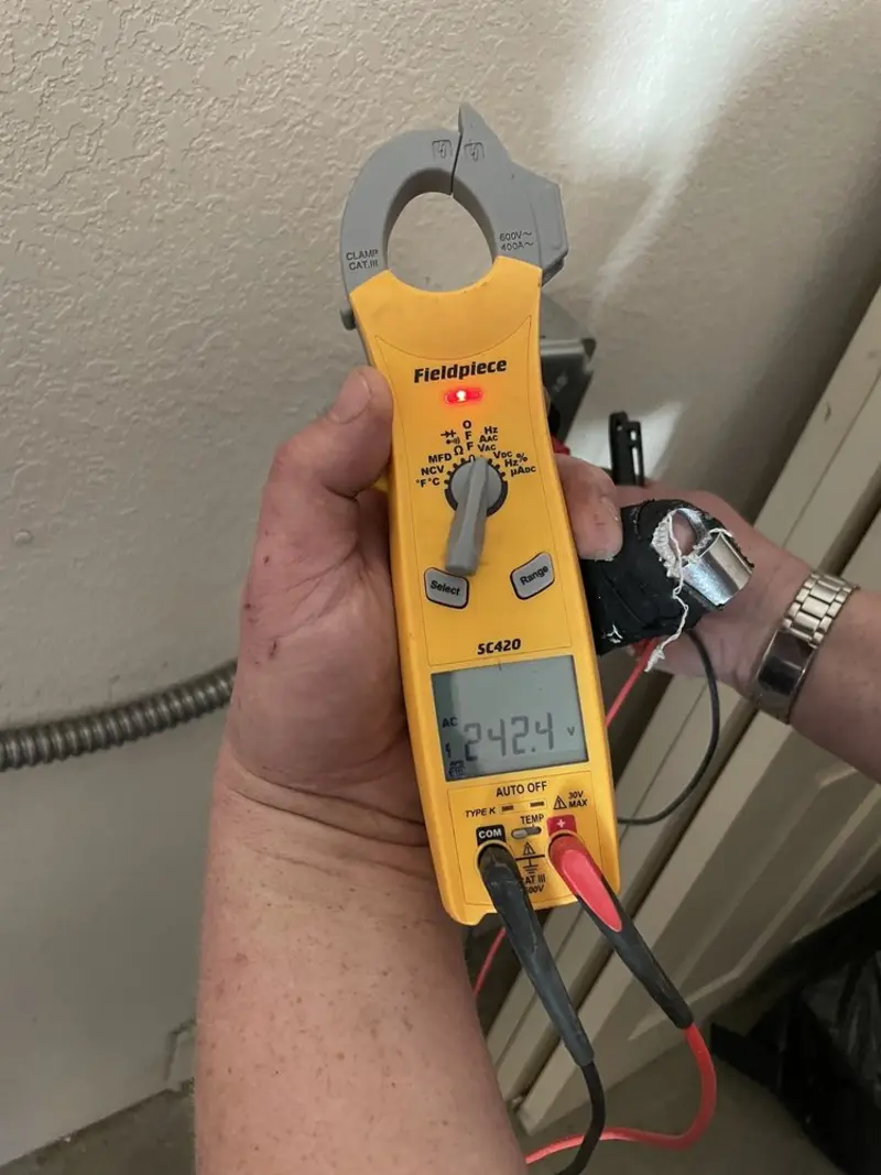 Voltage testing with clamp meter during Hot Tub / Pool Electrical Wiring in Hollis